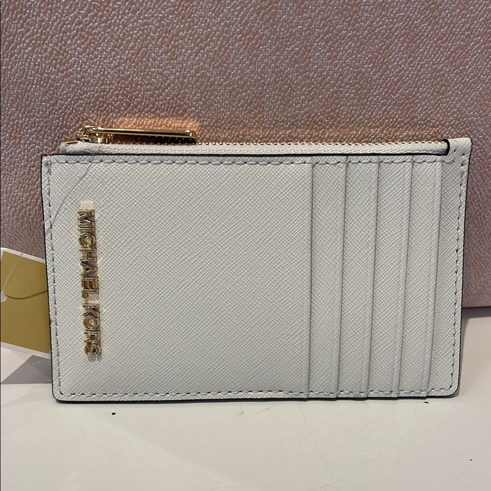 MICHAEL KORS
Jet Set Travel Md Top Zip Leather Card Case Wallet 
Optic White